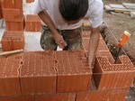 Construire un mur en briques creuses